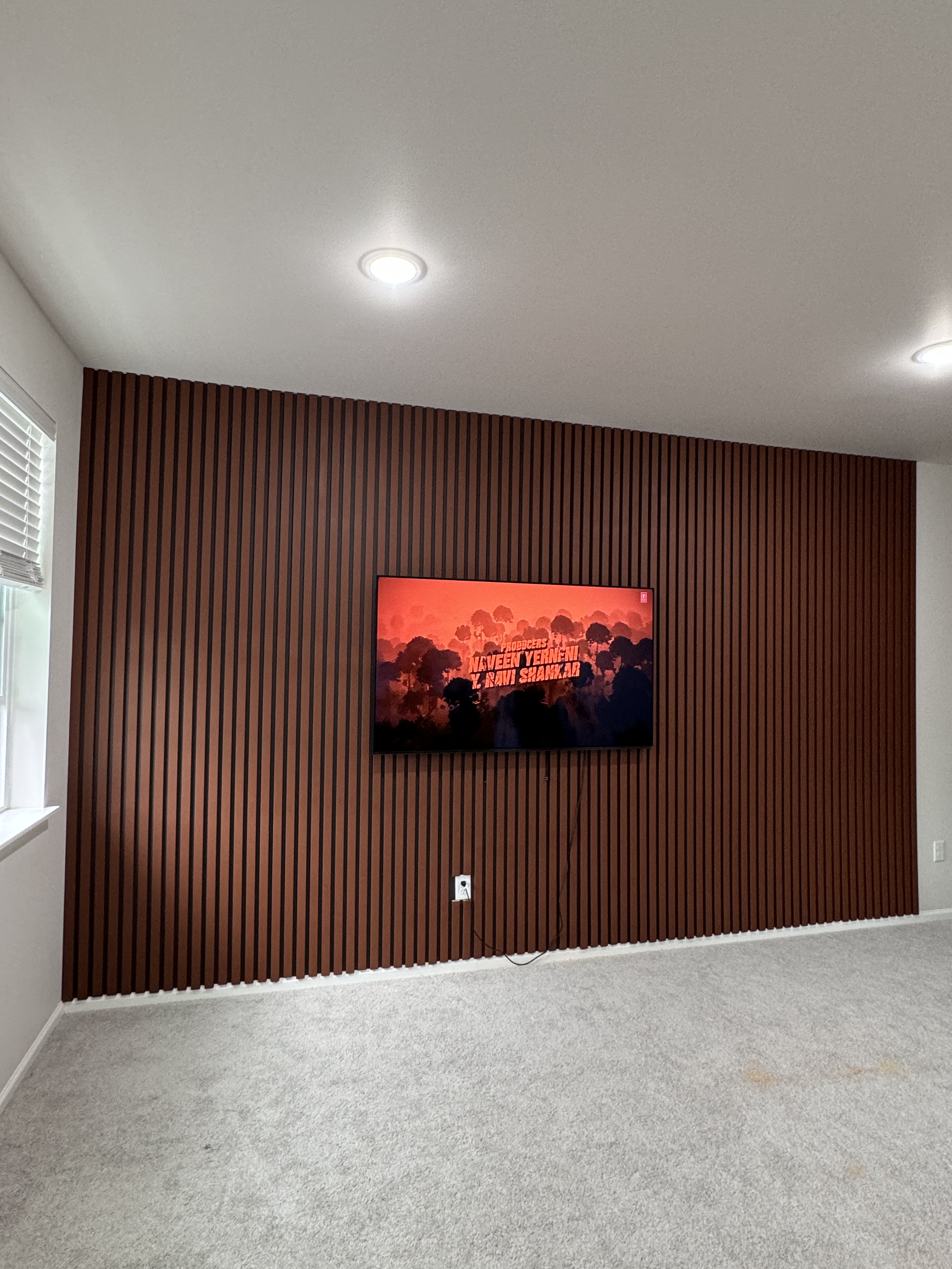 Finished slat wall with mounted television