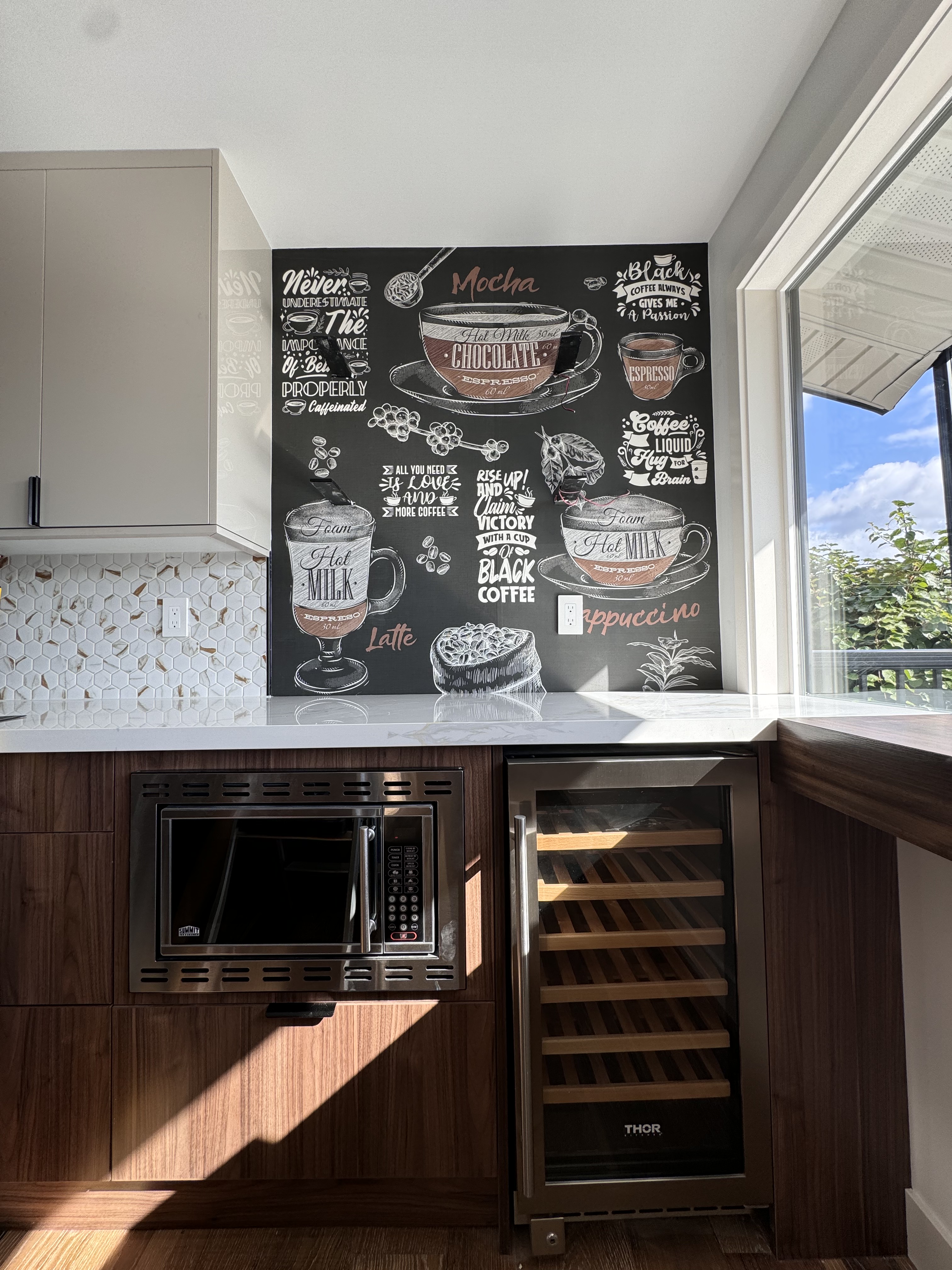 Coffee mural installed above a kitchen counter and wine refrigerator